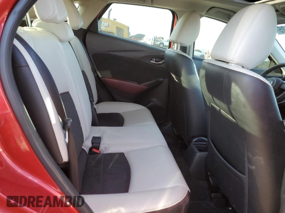 2018 Mazda CX-3 Grand Touring z VIN JM1DKFD79J0313779, wystawiony jako Copart lot #49120125 z przebiegiem 40 703 mil mil oraz Szkody całkowita. Historia ofert i sprzedaży dostępna na DreamBid. Obrazek 10.