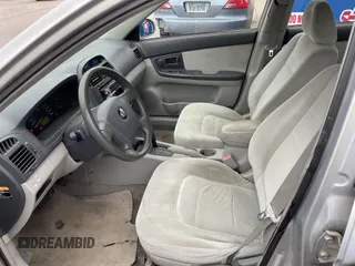 2004 Kia Spectra LX with VIN KNAFE121845043143, listed as a IAAI auction lot 41574523 with 211,758 mi miles. Bid and sale history available at carsss.com. Image 5.