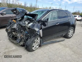 2015 Cadillac SRX Luxury Collection z VIN 3GYFNEE3XFS582499, wystawiony jako Copart lot #46655094 z przebiegiem Nie podano mil oraz Szkody całkowita. Historia ofert i sprzedaży dostępna na DreamBid. Obrazek 1.