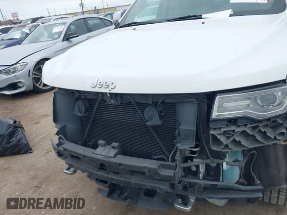 2014 Jeep Grand Cherokee Overland with VIN 1C4RJECG3EC266659, listed as a IAAI auction lot 41363419 with 142,896 mi miles. Bid and sale history available at carsss.com. Image 13.