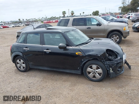 2015 MINI Hardtop 4 Door z VIN WMWXS5C58FT831568, wystawiony jako IAAI lot #42129819 z przebiegiem 76 044 mil mil oraz . Historia ofert i sprzedaży dostępna na DreamBid. Obrazek 14.