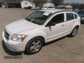 2009 Dodge Caliber SXT with VIN 1B3HB48A19D259105, listed as a IAAI auction lot 41881974 with 127,096 mi miles and . Bid and sale history available at DreamBid. Image 2.