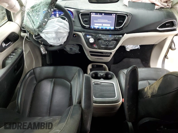 2023 Chrysler Pacifica Touring L with VIN 2C4RC1BG3PR582271, listed as a Copart auction lot 51644595 with 57,930 mi miles and Salvage title. Bid and sale history available at DreamBid. Image 8.