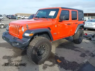 2019 Jeep Wrangler Unlimited Sport S with VIN 1C4HJXDG7KW568441, listed as a IAAI auction lot 41142271 with 73,698 mi miles and . Bid and sale history available at DreamBid. Image 2.