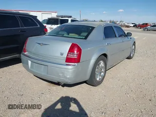 2006 Chrysler 300 C with VIN 2C3KA63H46H154990, listed as a IAAI auction lot 42004790 with 233,673 mi miles. Bid and sale history available at carsss.com. Image 4.