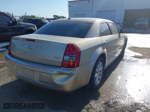 2009 Chrysler 300 Limited with VIN 2C3KA33V99H592963, listed as a IAAI auction lot 42041417 with 160,829 mi miles. Bid and sale history available at carsss.com. Image 4.