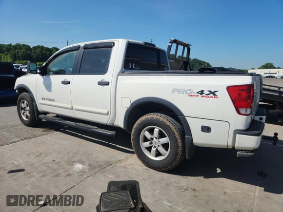 2012 Nissan Titan SL with VIN 1N6BA0EC9CN324495, listed as a Copart auction lot 60982445 with 142,430 mi miles and Salvage title. Bid and sale history available at DreamBid. Image 2.