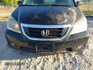 2010 Honda Odyssey Touring with VIN 5FNRL3H95AB031007, listed as a IAAI auction lot 41852435 with 207,919 mi miles. Bid and sale history available at carsss.com. Image 15.