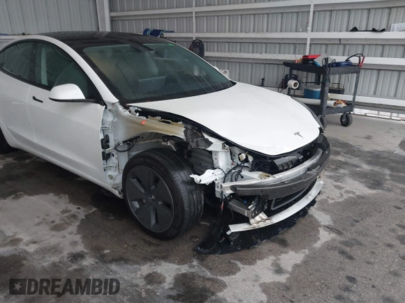 2023 Tesla Model 3 with VIN 5YJ3E1EA9PF548726, listed as a IAAI auction lot 42345157 with 30,647 mi miles and . Bid and sale history available at DreamBid. Image 6.