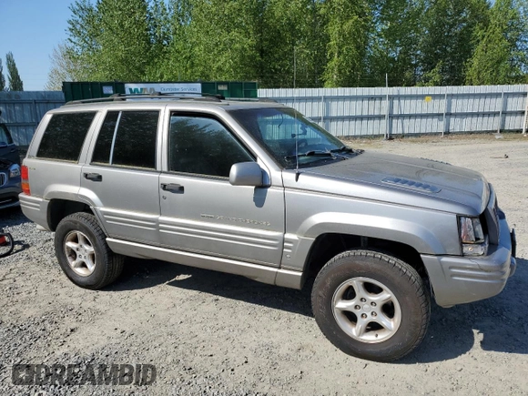 1998 Jeep Grand Cherokee Limited z VIN 1J4GZ88Z1WC231772, wystawiony jako Copart lot #55697775 z przebiegiem 178 896 mil mil oraz Czysty tytuł • Clean title. Historia ofert i sprzedaży dostępna na DreamBid. Obrazek 4.