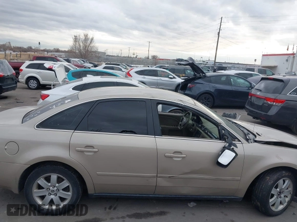 2005 Mercury Montego Luxury z VIN 1MEFM40185G611793, wystawiony jako IAAI lot #41125667 z przebiegiem Nie podano mil oraz . Historia ofert i sprzedaży dostępna na DreamBid. Obrazek 13.