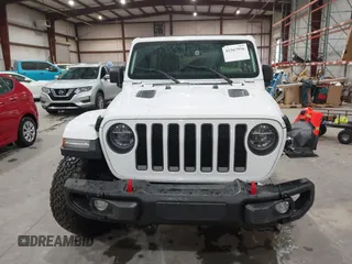 2021 Jeep Wrangler Unlimited Rubicon with VIN 1C4HJXFN2MW809904, listed as a IAAI auction lot 41567956 with 34,000 mi miles and . Bid and sale history available at DreamBid. Image 12.