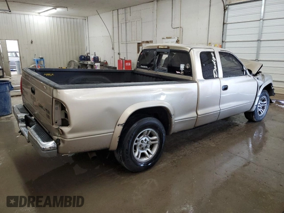 2003 Dodge Dakota SLT z VIN 1D7HL42N63S132141, wystawiony jako Copart lot #56138235 z przebiegiem 219 246 mil mil oraz Szkoda całkowita • Salvage title. Historia ofert i sprzedaży dostępna na DreamBid. Obrazek 3.
