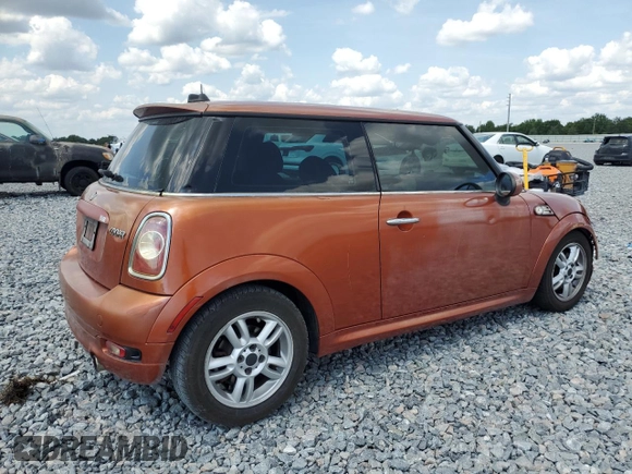 2011 MINI Hardtop with VIN WMWSU3C52BT094399, listed as a Copart auction lot 56561635 with 94,428 mi miles and Salvage Title. Bid and sale history available at DreamBid. Image 3.