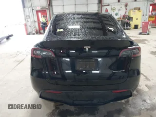 2023 Tesla Model Y Long Range with VIN 7SAYGDEE2PF808844, listed as a IAAI auction lot 41941905 with 39,951 mi miles and . Bid and sale history available at carsss.com. Image 17.