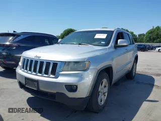 2012 Jeep Grand Cherokee Laredo with VIN 1C4RJEAG5CC112230, listed as a IAAI auction lot 41997483 with 302,923 mi miles. Bid and sale history available at carsss.com. Image 18.
