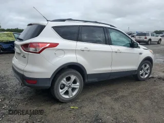 2013 Ford Escape SE with VIN 1FMCU0GX3DUB86597, listed as a Copart auction lot 59513935 with 94,293 mi miles and Salvage title. Bid and sale history available at DreamBid. Image 3.