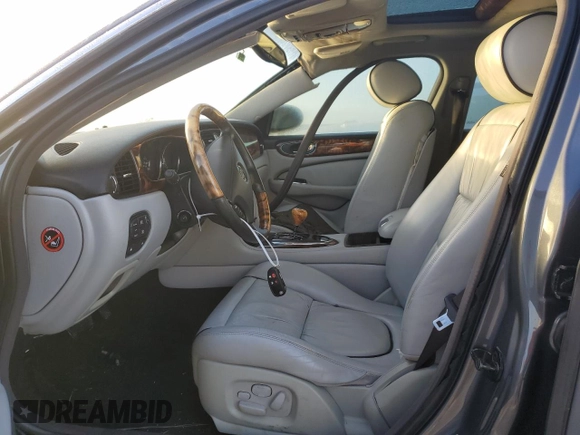 2004 Jaguar XJ with VIN SAJEA74C24SG09038, listed as a Copart auction lot 77015544 with Not Provided miles and Salvage Title. Bid and sale history available at DreamBid. Image 7.