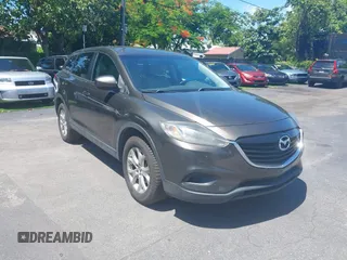 2015 Mazda CX-9 Touring z VIN JM3TB2CV1F0458995, wystawiony jako IAAI lot #42523344 z przebiegiem 130 763 mil mil oraz . Historia ofert i sprzedaży dostępna na DreamBid. Obrazek 1.