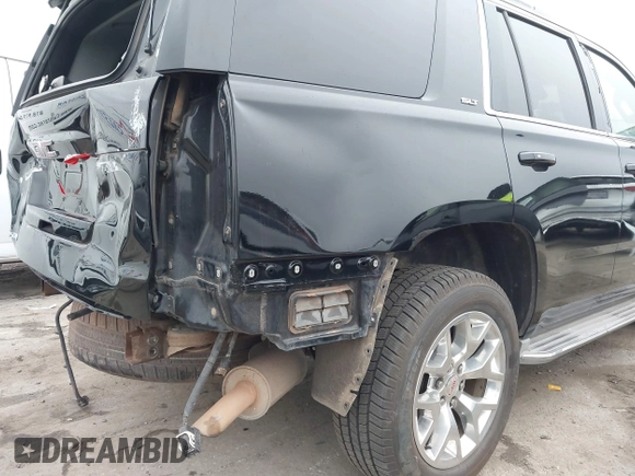 2015 GMC Yukon SLT with VIN 1GKS1BKC3FR129173, listed as a IAAI auction lot 41795585 with 97,893 mi miles. Bid and sale history available at carsss.com. Image 18.