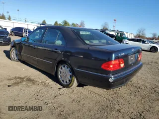 1996 Mercedes-Benz E Class with VIN WDBJF20F5TJ021801, listed as a Copart auction lot 80188074 with 196,397 mi miles and Salvage Title. Bid and sale history available at carsss.com. Image 2.