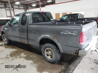2003 Ford F-150 XL with VIN 1FTRX18W63NB69173, listed as a IAAI auction lot 41618645 with 219,506 mi miles. Bid and sale history available at carsss.com. Image 3.