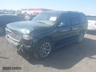 2004 GMC Yukon Denali with VIN 1GKEK63U24J265167, listed as a IAAI auction lot 41877785 with 256,691 mi miles. Bid and sale history available at carsss.com. Image 2.