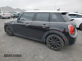 2017 MINI Hardtop 4 Door Cooper with VIN WMWXU1C30H2E19304, listed as a Copart auction lot 51008575 with 34,526 mi miles and Salvage Title. Bid and sale history available at DreamBid. Image 2.