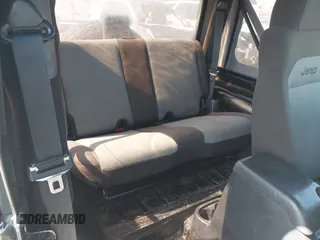 2005 Jeep Wrangler X with VIN 1J4FA39S35P372731, listed as a IAAI auction lot 41875121 with 146,034 mi miles and . Bid and sale history available at DreamBid. Image 8.