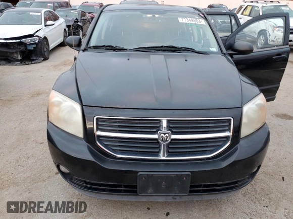 2010 Dodge Caliber Mainstreet z VIN 1B3CB3HAXAD551716, wystawiony jako Copart lot #77349503 z przebiegiem 144 209 mil mil oraz Tytuł czysty. Historia ofert i sprzedaży dostępna na DreamBid. Obrazek 5.