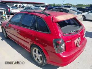 2002 Mazda Protege with VIN JM1BJ246721565634, listed as a IAAI auction lot 41984727 with 235,764 mi miles and . Bid and sale history available at DreamBid. Image 3.