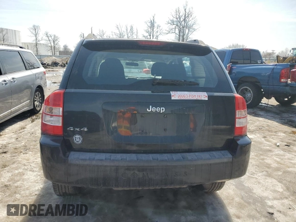 2010 Jeep Compass Sport with VIN 1J4NF4FB2AD591523, listed as a Copart auction lot 48809775 with 105,720 mi miles and Salvage Title. Bid and sale history available at carsss.com. Image 6.