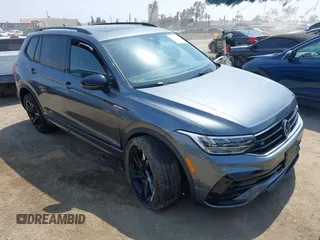 2023 Volkswagen Tiguan SE R-Line Black with VIN 3VVCB7AX8PM036684, listed as a IAAI auction lot 42169004 with 25,024 mi miles and . Bid and sale history available at DreamBid. Image 1.