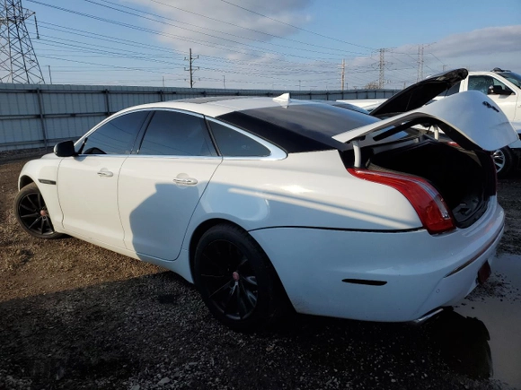2013 Jaguar XJ with VIN SAJWJ1CD6D8V50968, listed as a Copart auction lot 79880924 with 136,280 mi miles and Salvage Title. Bid and sale history available at carsss.com. Image 2.