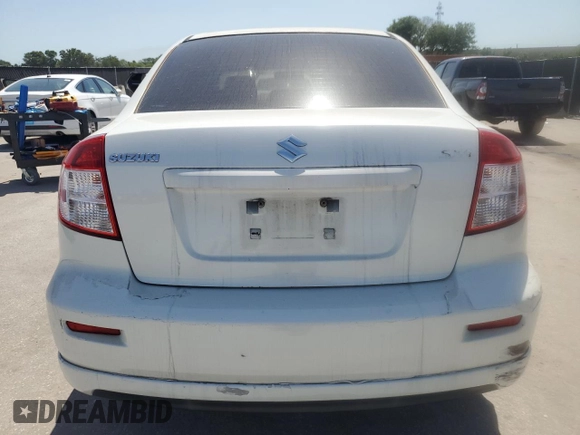 2009 Suzuki SX4 z VIN JS2YC416396200021, wystawiony jako Copart lot #56676075 z przebiegiem 150 981 mil mil oraz Szkoda całkowita • Salvage title. Historia ofert i sprzedaży dostępna na DreamBid. Obrazek 6.