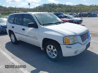 2006 GMC Envoy SLE with VIN 1GKDT13SX62258586, listed as a IAAI auction lot 42045967 with 143,225 mi miles. Bid and sale history available at carsss.com. Image 1.
