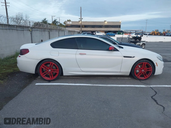 2013 BMW 6 Series 650i with VIN WBAYM9C57DDW20312, listed as a IAAI auction lot 41861212 with 98,662 mi miles and . Bid and sale history available at carsss.com. Image 13.