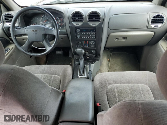 2003 GMC Envoy SLE z VIN 1GKDT13S432160651, wystawiony jako Copart lot #56938205 z przebiegiem 197 593 mil mil oraz Szkoda całkowita • Salvage title. Historia ofert i sprzedaży dostępna na DreamBid. Obrazek 8.