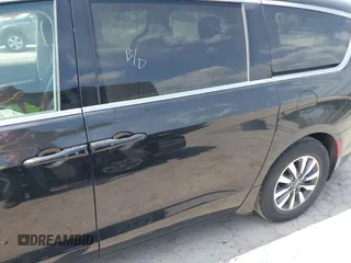 2023 Chrysler Pacifica Hybrid Touring L with VIN 2C4RC1L75PR592251, listed as a IAAI auction lot 42037873 with 44,428 mi miles and . Bid and sale history available at DreamBid. Image 14.