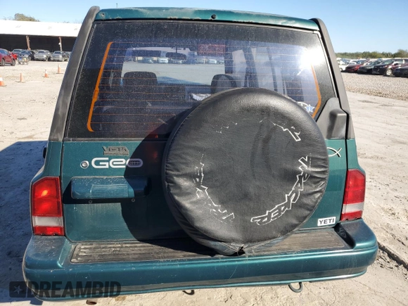 1996 Geo Tracker z VIN 2CNBE1363T6921541, wystawiony jako Copart lot #81647384 z przebiegiem 61 806 mil mil oraz Szkoda całkowita • Salvage title. Historia ofert i sprzedaży dostępna na DreamBid. Obrazek 6.