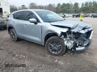 2021 Mazda CX-5 Touring with VIN JM3KFBCM9M1329806, listed as a IAAI auction lot 41825123 with 59,300 mi miles. Bid and sale history available at carsss.com. Image 1.