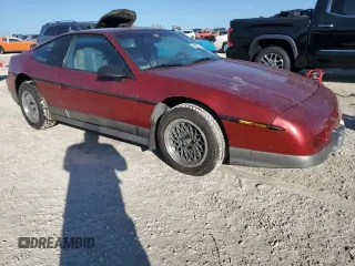 1987 Pontiac Fiero GT z VIN 1G2PG1195HP233666, wystawiony jako Copart lot #78981714 z przebiegiem Nie podano mil oraz Szkody całkowita. Historia ofert i sprzedaży dostępna na DreamBid. Obrazek 4.