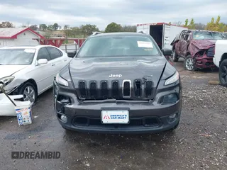 2014 Jeep Cherokee Altitude with VIN 1C4PJMCB7EW232678, listed as a IAAI auction lot 40812147 with 105,828 mi miles. Bid and sale history available at carsss.com. Image 13.
