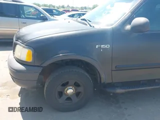 2000 Ford F-150 XL z VIN 2FTRX18L8YCA51967, wystawiony jako IAAI lot #42478391 z przebiegiem Nie podano mil oraz . Historia ofert i sprzedaży dostępna na DreamBid. Obrazek 6.