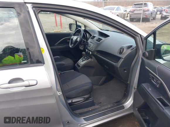 2012 Mazda 5 Sport with VIN JM1CW2BLXC0107933, listed as a IAAI auction lot 41813231 with 164,395 mi miles and . Bid and sale history available at DreamBid. Image 5.