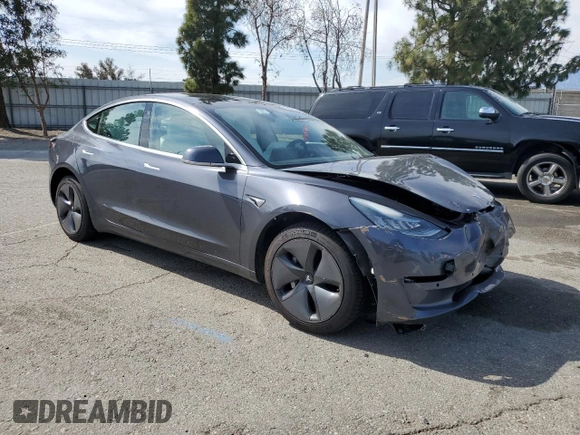 2019 Tesla Model 3 Mid Range with VIN 5YJ3E1EA0KF445185, listed as a Copart auction lot 48630675 with 76,351 mi miles and Salvage Title. Bid and sale history available at carsss.com. Image 4.