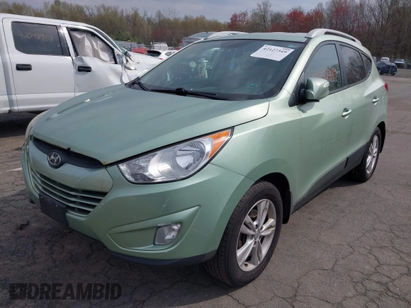 2013 Hyundai Tucson GLS with VIN KM8JU3AC7DU580229, listed as a IAAI auction lot 42127349 with 204,975 mi miles. Bid and sale history available at carsss.com. Image 2.