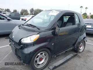 2013 Smart fortwo Pure with VIN WMEEJ3BA1DK651627, listed as a IAAI auction lot 42733791 with 130,561 mi miles and . Bid and sale history available at DreamBid. Image 2.