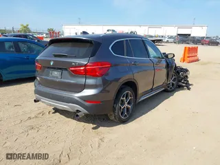 2017 BMW X1 xDrive28i with VIN WBXHT3C39H5F79706, listed as a IAAI auction lot 40168464 with 1 mi miles. Bid and sale history available at carsss.com. Image 4.