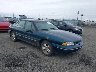 1998 Pontiac Bonneville SE with VIN 1G2HX52K0W4211117, listed as a IAAI auction lot 42125471 with 187,249 mi miles. Bid and sale history available at carsss.com. Image 1.
